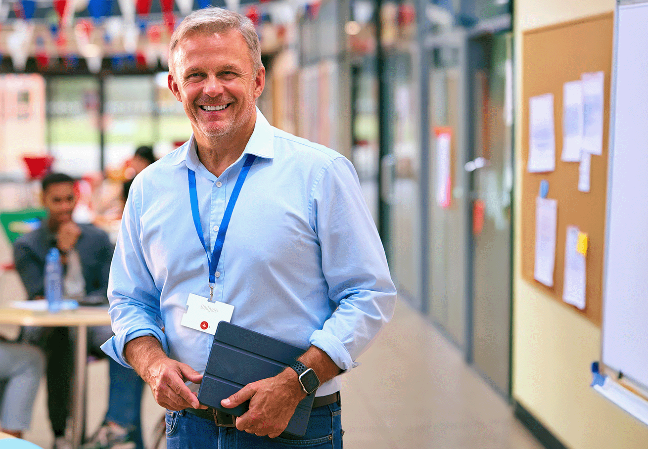 BadgeR+ - Male Teacher Wearing the BadgeR+ and Smiling at the Camera - Photo Mockup