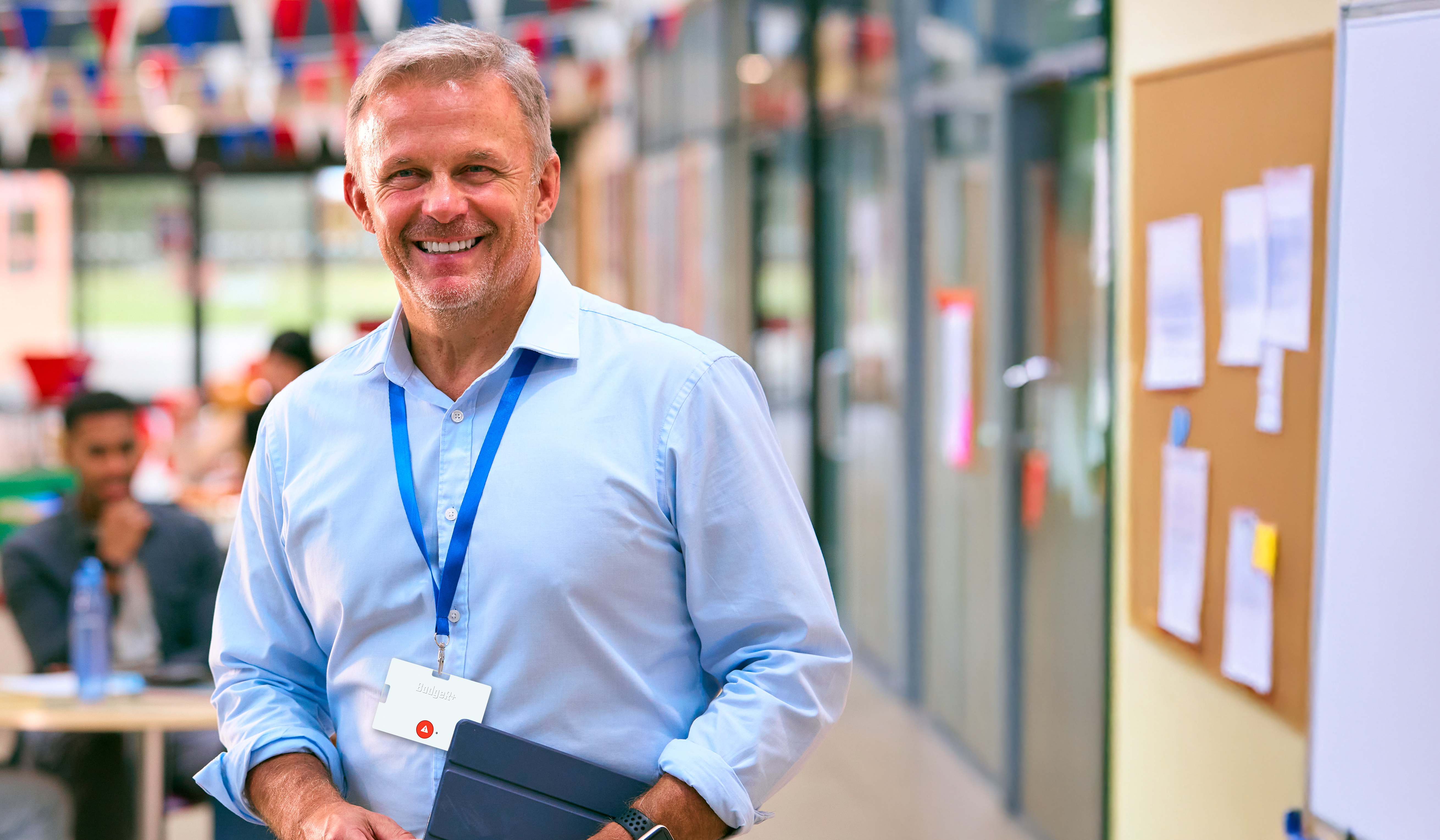 BadgeR+ - Mockup - Smiling Male Teacher Looking at Camera - v2